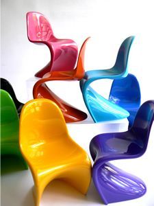 colorful plastic chairs are arranged in a row