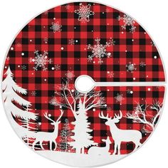 a red and black plaid christmas tree skirt with white reindeers on the snowflakes