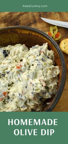 homemade olive dip in a bowl with crackers on the side and text overlay that reads homemade olive dip