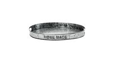 a metal tray with the words home made on it and an inscription that reads, beware