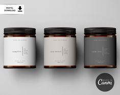 three jars with labels on them sitting next to each other in front of a gray background