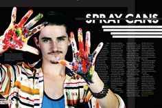 a man with his hands covered in paint is posing for a magazine cover page,