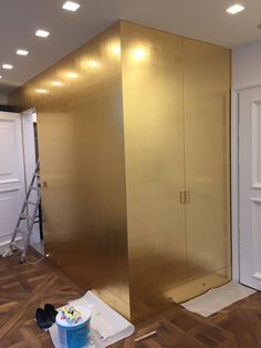 a room that is being remodeled with gold paint