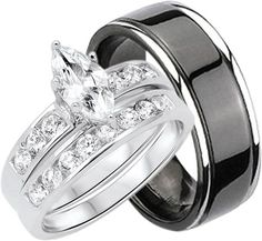 two wedding rings with black bands and white diamonds on each band, set in 18k white gold