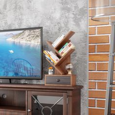 a flat screen tv sitting on top of a wooden stand next to a brick wall