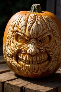 a carved pumpkin sitting on top of a wooden table