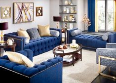 a living room filled with blue couches and chairs