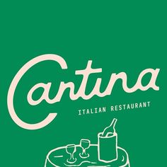 a green poster with the words cantina written in white on top of a table