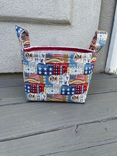 an american flag purse sitting on top of a wooden floor