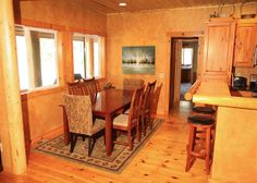 a dining room table and chairs in a kitchen