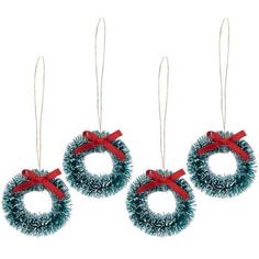 three christmas wreath ornaments hanging from strings