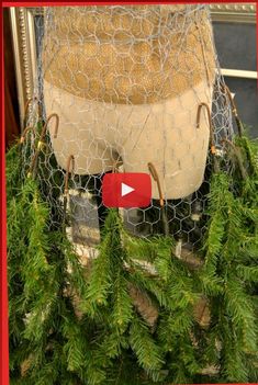 a video demonstrating how to make a chicken wire chair out of hay and pine needles