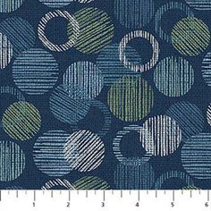 a blue and green fabric with circles on it