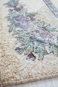 an area rug with floral designs on it