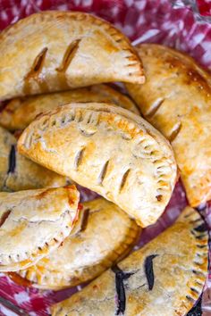 several pastries on a red and white plate