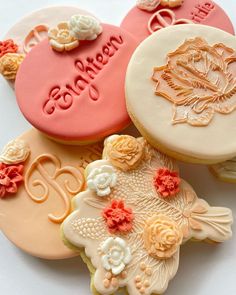 three decorated cookies sitting on top of each other