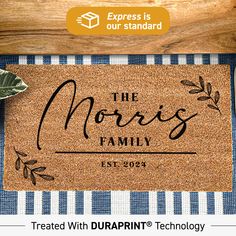 a door mat that says the morris family on it with an image of leaves