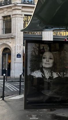 a store front with an advertisement on the side of it's glass display window