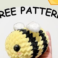 a hand holding a small yellow and black crocheted bee with the words free pattern below it