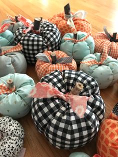 several pumpkins are sitting on the floor with black and white checkered fabric around them