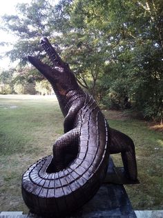 a statue of an alligator with its mouth open