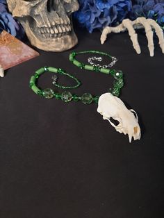 Have a Look at This Green Mink Skull Necklace! It is Adjustable up to 18 - 22 Inches. All Items Ship Within 1-3 Days via USPS First Class Service. Shipping on This Necklace Will be 5.00 (USA ONLY ) Additional Items are Free! International Shipping Will Be 20.00, And All Additional Items Add 5.00 to the Shipping Cost. International Shipping May Take 2 - 4 Weeks To Deliver. All The Bones Here are Legal To Buy, Sell, And Own In The United States We are Happy To answer Any Questions You may have, In Goth Wedding Jewelry, Voodoo Witch Doctor, Unique Handmade Bone-colored Necklace, Symbolic Handmade Skull Necklaces, Voodoo Witch, Animal Bone Necklace, Doctor Jewelry, Unique Handmade Bone Necklace, Bone Bead Necklace