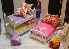 a doll house bedroom with two twin beds