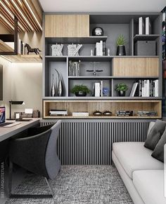 a modern home office with built - in bookshelves and shelving units on the wall