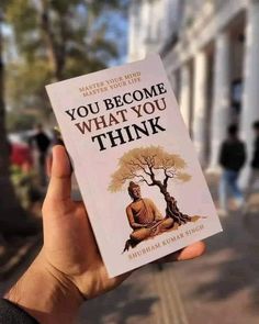 someone is holding up a book that says, you become what you think