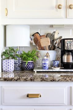 a kitchen counter with pots and pans on it