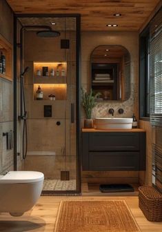 a bathroom with a toilet, sink and shower stall in the middle of the room