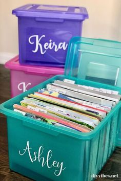 three plastic storage boxes filled with files on top of a wooden table and the words, diy memory box to organize your child's papers