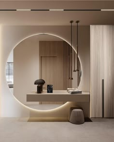 a bathroom with a large circular mirror on the wall above it and a stool in front of it