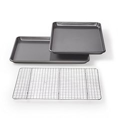 two baking pans and a cooling rack on a white background