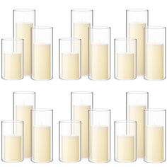 a set of twelve glasses filled with milk