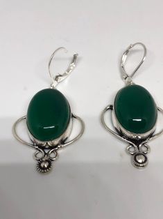 Antique vintage Green Chrysoprase Silver dangle earrings Delicate and detailed hand set vintage green chrysoprase Antique and Silver leverback earrings These dangle earrings are about 2 inch long All jewelry is shipped in a nice gift box. Check out our over a THOUSAND great reviews Can be converted to Clip on earrings add request Classic Green Earrings With Ear Wire, Green Onyx Drop Earrings, Vintage Green Dangle Jewelry, Formal Green Nickel-free Earrings, Victorian Green Drop Earrings, Vintage Cabochon Dangle Earrings, Vintage Green Cabochon Earrings, Antique Green Drop Earrings, Green Cabochon Drop Earrings