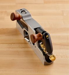 a pair of woodworking tools sitting on top of a wooden table