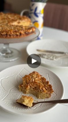 a table topped with two plates filled with pie