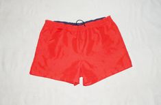 "Vintage 90s/2000s Men's Beachwear Training Short Shorts Authentic FILA GOOD Vintage Condition Washed and Sanitized !! Red colour 2 Side pockets Please see pics for details Polyester Label Size : US S, IT 46/48 . Men's Please to better fit read the measurements below. Elastic Waist 17.5 to 19.5 inches, 44 to 50 cm. Round Waist 38\" Lenght 12 in. , 32 cm. (on the side) WASHED and SANITIZED We Post From Italy This is a PRIVATE SALE The Photos are Real of the Item I sell in this Listing. IF YOU HAV Casual Fitted Red Swim Trunks, Red Fitted Casual Swim Trunks, Fitted Red Casual Swim Trunks, Red Bottoms With Pockets For Beach Season, Retro Red Beach Shorts, Vintage Red Bottoms For Beach, Olympic Triathlon, 2000s Men, Fila Vintage