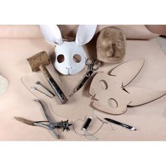 a table topped with lots of different types of crafting tools and bunny ears on top of each other