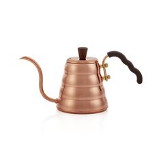 a copper colored coffee pot with a wooden handle