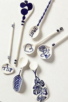 spoons with different designs on them sitting next to each other