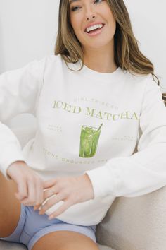 Matcha, anybody? This white Gildan crewneck sweatshirt, featuring sophisticated lettering and the cutest graphic, is perfect for all of our matcha girlies 🍵 GROUP ORDERS: Please use the code "CHEERSDISCOUNT" to get 10% OFF when you purchase 10 or more items from the Cheers Collection! CameronHeight: 5’9Bust: 34CShe is wearing a size small Trendy Green Sweatshirt With Text Print, Girl Tribe, Graphic Apparel, Girl Sweatshirts, Custom Embroidery, Clothes Collection, Sale House, Women Collection, The Cutest