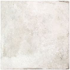 a white tile floor with some dirt on it