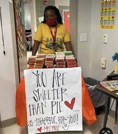 a woman standing behind a sign that says you are sweeter than pie