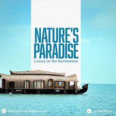 a boat floating on top of the ocean next to a tall white sign that says nature's paradise