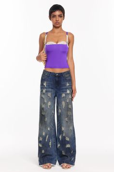 Fits true to size Low-rise Distressed detailing throughout Washed in a deep indigo blue with faded accents 5 pockets styling Jeans Tank Top, Deep Indigo, Causal Outfits, New Tops, Indigo Blue, Lace Bra, Set Dress, Low Rise, Tank Top