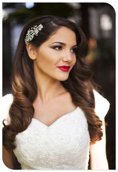 a woman with long hair wearing a wedding dress