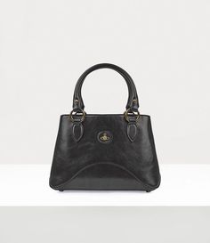 The Britney Small handbag has been refreshed this season in polished black leather. The design adopts a new flat version of our house's iconic orb motif, which Vivienne Westwood used to represent launching tradition into the future, set on top of a leather tab. Black Small Handbag, Small Black Handbag, Black Vivienne Westwood, New Flat, Black Handbag, Fancy Bags, Small Handbag, Woman Bags Handbags, Backpack Travel Bag