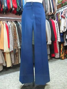 Amazing original 70s deadstock flared pants. NOS 70s pants/trousers. Made in France by "PEROCHE" (pics 7-8). Pure wool. Bright blue coloured. High waist and no pockets. Slim-fitting. Mint conditions. They fit size M about 8-10 US Size 40-42 EU Measurements: (lay flat and double waist and hips) Waist 29.9" hips 40.1" rise 11.4" inseam 34.2" bottom width 13" X 2 Misure: Vita 76 cms fianchi 102 cms cavallo 29 cms lungh. int.gamba 87 cms ampiezza zampa 33 cms X 2 In order to avoid any unpleasant mis Blue Stretch Full-length Flares, Blue Flare Pants For Work, Fall Blue Wide Leg Flares, High Waist Blue Flares, Retro Fitted Wide-leg Pants, Retro Fitted Wide Leg Flare Pants, Retro Stretch Wide Leg Full-length Pants, Blue Fitted Wide-leg Flares, Blue High Waist Fitted Flares